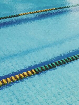 Swimming pool with lane markers in blue water