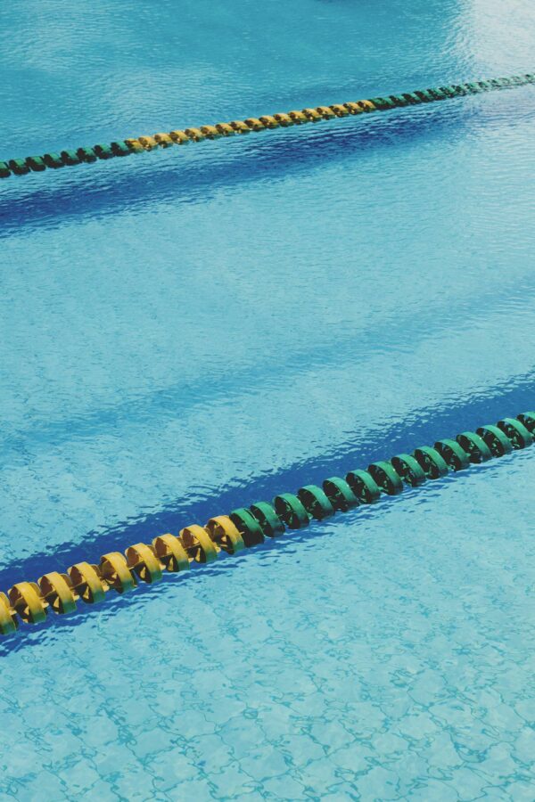 Swimming pool with lane markers in blue water